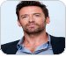 Foto de Hugh Jackman de camisa azul e blazer